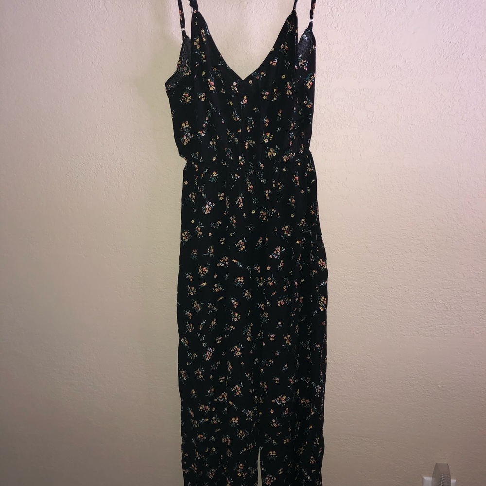Long romper w/ruffle tank top sleeves.